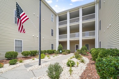 Situated in the heart of Surfside Beach, this second-floor condo - photo 2