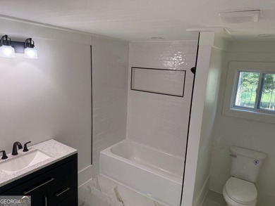 This beautifully renovated 2-bedroom, 2.5-bath home is move-in