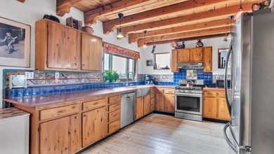 Rare Ranchette with an Adobe Residence, Guest Home & Water - photo 9