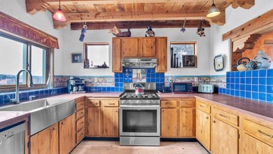 Rare Ranchette with an Adobe Residence, Guest Home & Water - photo 10