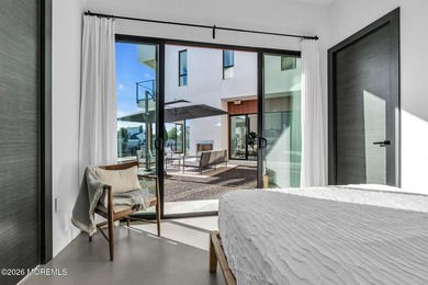 A rare modern waterfront retreat, this architect-designed home - photo 31