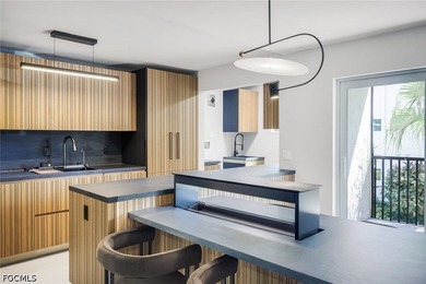 Exquisitely remodeled second-floor condominium in the highly - photo 1