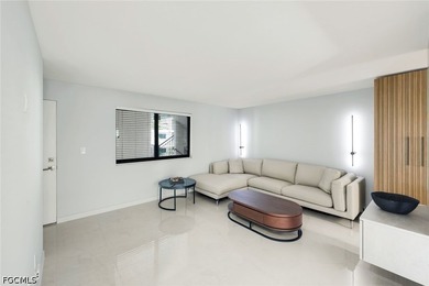 Exquisitely remodeled second-floor condominium in the highly - photo 8