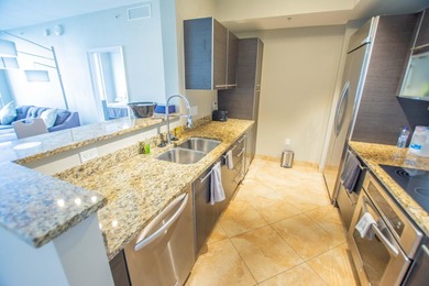 Enjoy beautiful city views from this residence in a full-service - photo 4