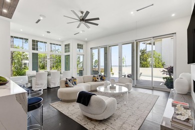 Located in the prestigious gated waterfront community of - photo 11