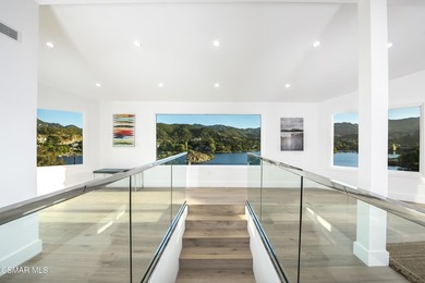 A modern residence defined by glass, light, and landscape. - photo 13
