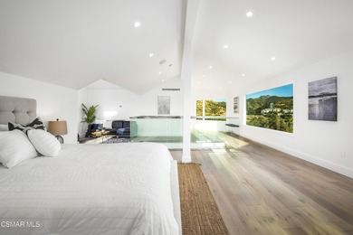 A modern residence defined by glass, light, and landscape. - photo 14