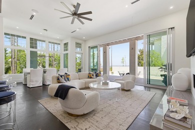 Located in the prestigious gated waterfront community of - photo 15