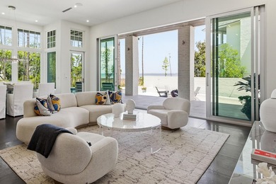 Located in the prestigious gated waterfront community of - photo 16