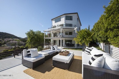 A modern residence defined by glass, light, and landscape. - photo 17