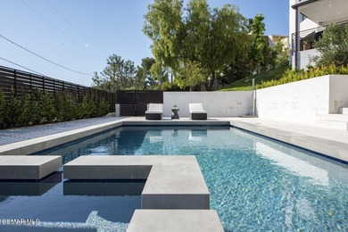 A modern residence defined by glass, light, and landscape. - photo 18