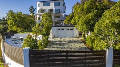 A modern residence defined by glass, light, and landscape. - photo 19