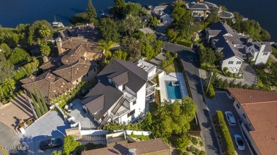 A modern residence defined by glass, light, and landscape. - photo 20