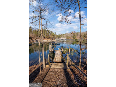 Sitting on a deep-water cove with water views, this fully - photo 5