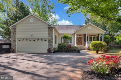 Discover this stunning raised ranch home nestled in the - photo 1