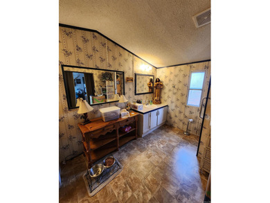 Peaceful country living awaits on this 3.4 acre wooded property