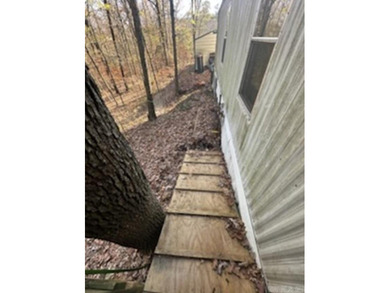 Peaceful country living awaits on this 3.4 acre wooded property