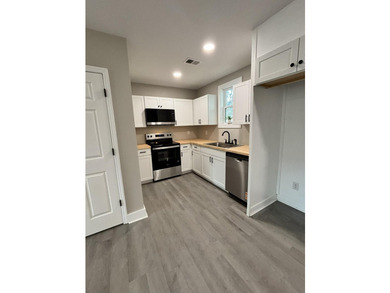 Welcome Home! This adorable home has been fully renovated and is - photo 6