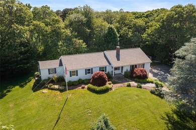 Perched atop a hillside along a winding drive, this one level - photo 1