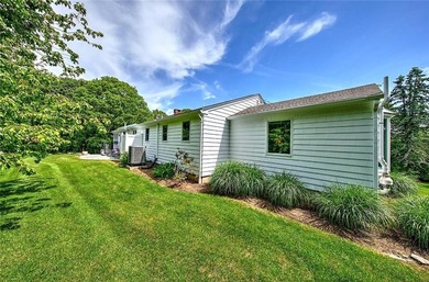 Perched atop a hillside along a winding drive, this one level - photo 7