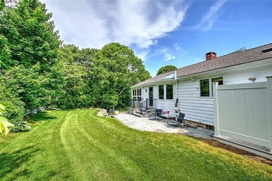 Perched atop a hillside along a winding drive, this one level - photo 8