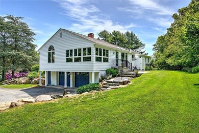 Perched atop a hillside along a winding drive, this one level - photo 9