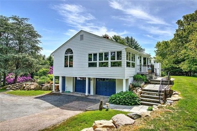 Perched atop a hillside along a winding drive, this one level - photo 10