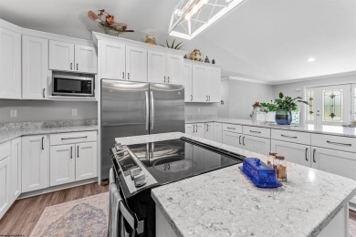 Tucked away on a private road, this gorgeous home offers the