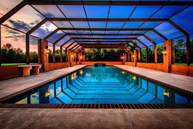 Welcome to a one-of-a-kind luxury estate on over 10 pristine