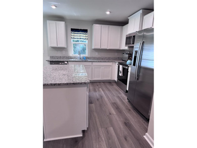 Welcome home to this never-before-lived-in end unit 3-bedroom, 2 - photo 7