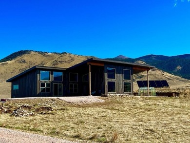 This custom 2024 mountain contemporary home sits on 20 acres - photo 1