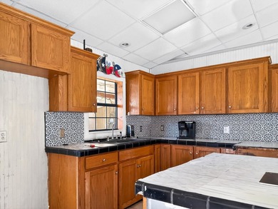 Located in Pine Harbor near Lake O' the Pines, this single-story - photo 11