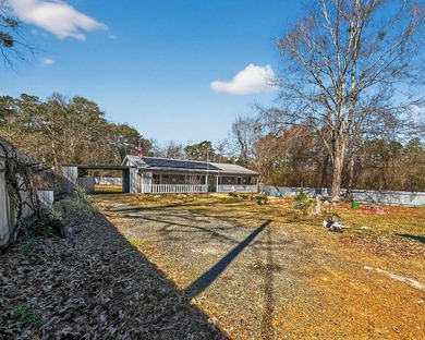 Located in Pine Harbor near Lake O' the Pines, this single-story - photo 39