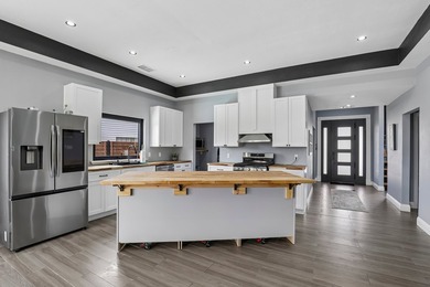 NEW IMPROVED PRICE ADJUSTMENT ON THIS BEAUTIFUL LUXURY HOME WITH - photo 9
