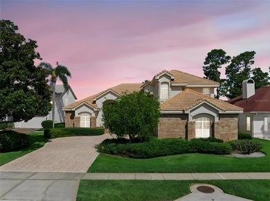 Experience exceptional lakefront living in this custom-built - photo 1