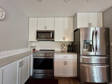 Welcome to this stunningly updated condominium in the desirable - photo 9