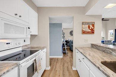 Exceptional marsh-front views, a spacious two-story layout, and - photo 8