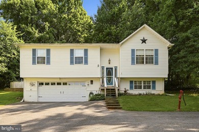 Nestled in the serene community of Apple Mt Lake, this charming - photo 5