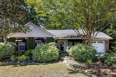 This charming brick home sits in a cul-de-sac on a quiet street - photo 1
