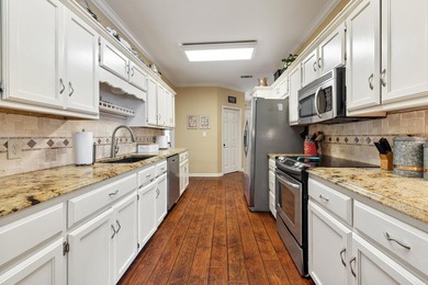 This well-maintained brick home offers a spacious and great - photo 3