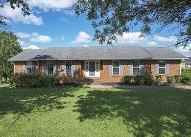Move-in ready and full of space, this charming brick ranch in - photo 1
