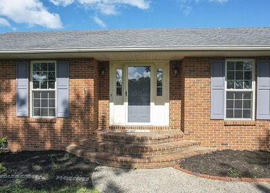 Move-in ready and full of space, this charming brick ranch in - photo 2