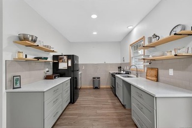 Situated on a beautifully cleared lot surrounded by mature trees - photo 11