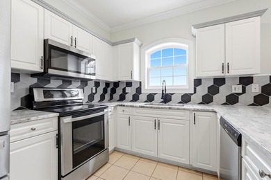 Welcome to this updated 3-bedroom, 2-bath end-unit condo in The - photo 10