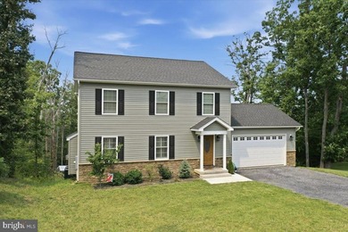 Welcome home to this like-new retreat nestled on just over an - photo 3