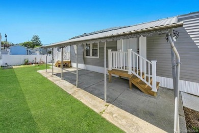 Welcome to this beautifully maintained 2-bedroom, 1-bath mobile - photo 3