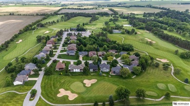 Enjoy sweeping golf course views from this ideally located brick - photo 1