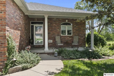Enjoy sweeping golf course views from this ideally located brick - photo 3