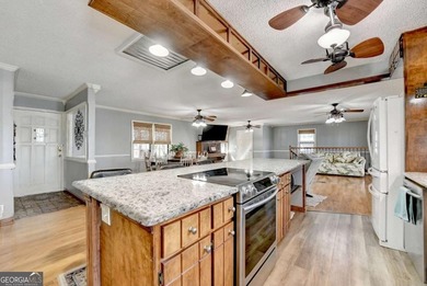 Situated on DEEP WATER,tucked away on nearly an acre along the - photo 8