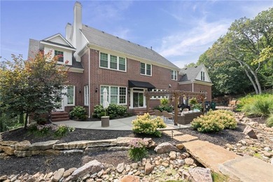 Welcome to this custom-built colonial home in the prestigious
